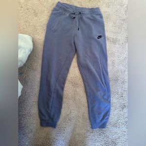 Purple Nike lightweight sweatpants. Small stain by waistband pictured